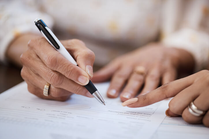 Woman signing personal injury document