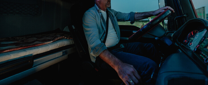 middle-aged man driving a truck