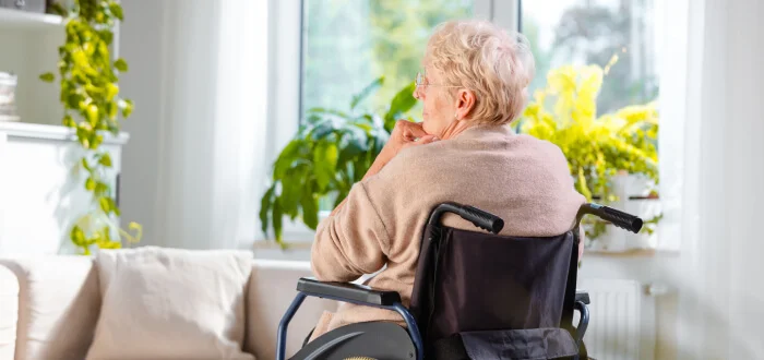 elder woman alone in a wheelchair